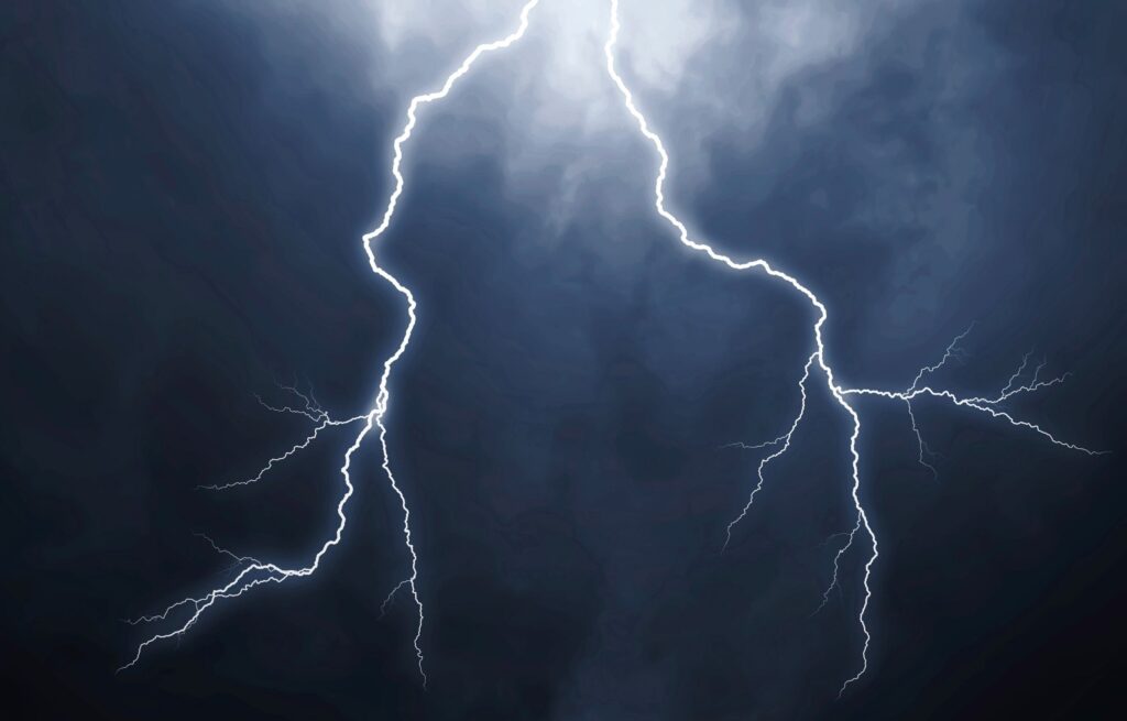 Lightning bolts in the sky, demonstrating the need for surge protection UK