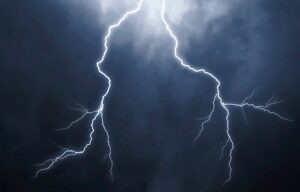 Lightning bolts in the sky, demonstrating the need for surge protection UK